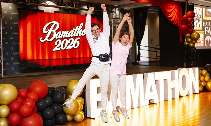UA Miracle students jumping on Bamathon stage